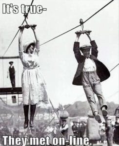 old fashioned picture of man and woman on a zip line