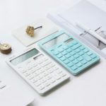 2 calculators on a desk