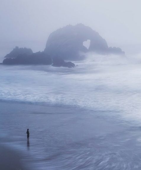 Woman walking on beach thinking about divorce