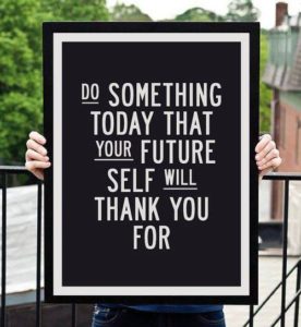 hands holding a sign that says "Do something today that your future self will thank you for"