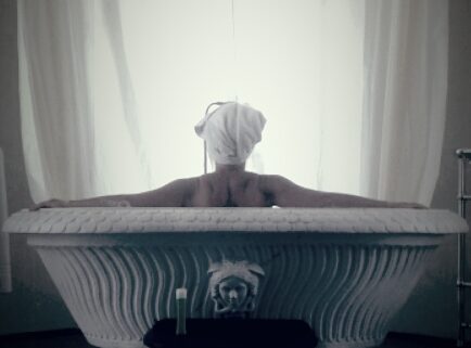 Woman in tub considering her life after divorce