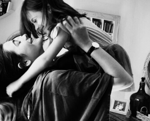 Single mother lifting her daughter