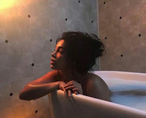 A woman in a bathtub contemplating what divorce does to a woman