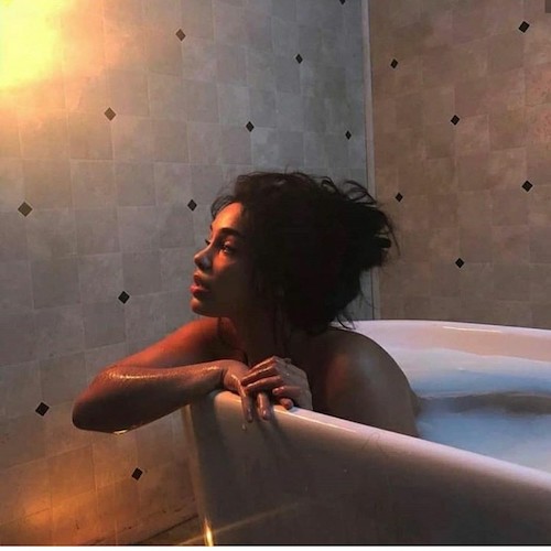 A woman in a bathtub contemplating what divorce does to a woman