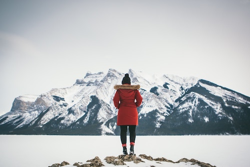 Woman in the snow contempltaing managing conflict in divorce