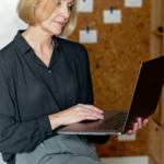 Woman researching online divorce services on a laptop while sitting in a home office