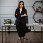 Woman standing confidently in an office, representing legal guidance and separation agreement decisions